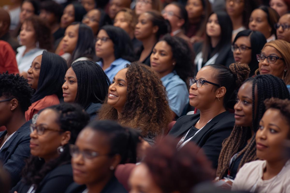 Black women entrepreneurs attending a business conference focused on networking, leadership, and growth